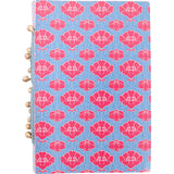 Notebook with pink floral pattern on a blue background