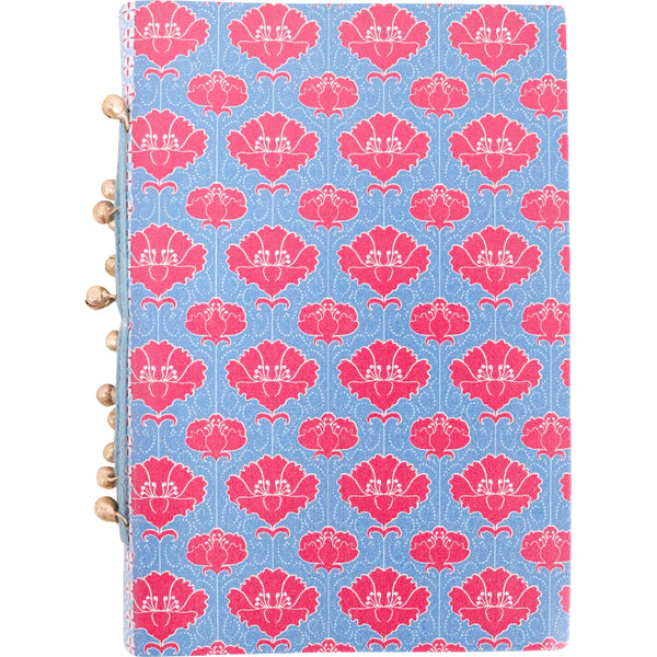 Notebook with pink floral pattern on a blue background