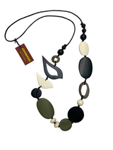 Necklace with black, green, and white beads on a white background