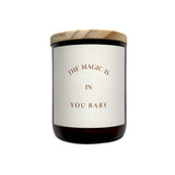 Candle with a wooden lid and a label on a white background