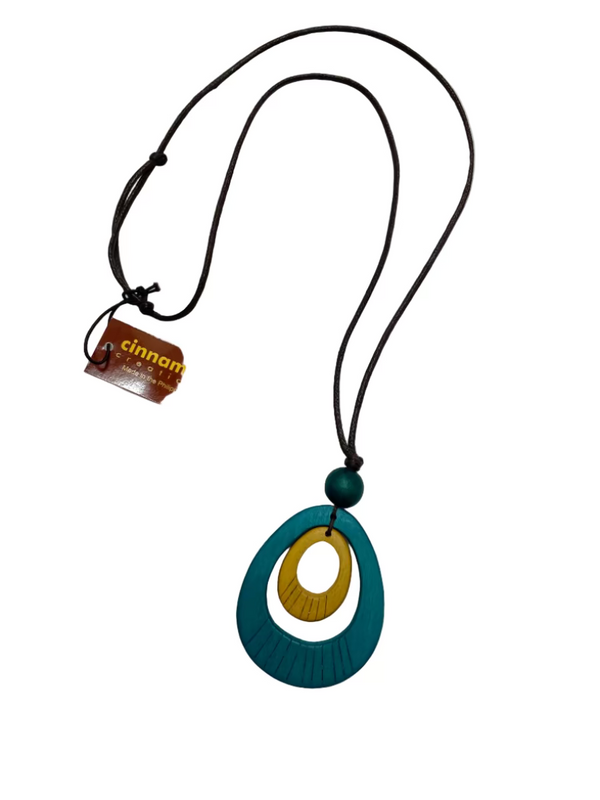 Necklace with a blue and gold pendant on a white background, featuring a 'cinnamon' brand tag.