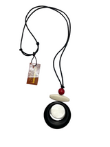 Necklace with pendant and tag on a white background