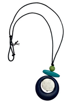 Necklace with a pendant on a white background, featuring the brand 'Cinnamon Creations'.