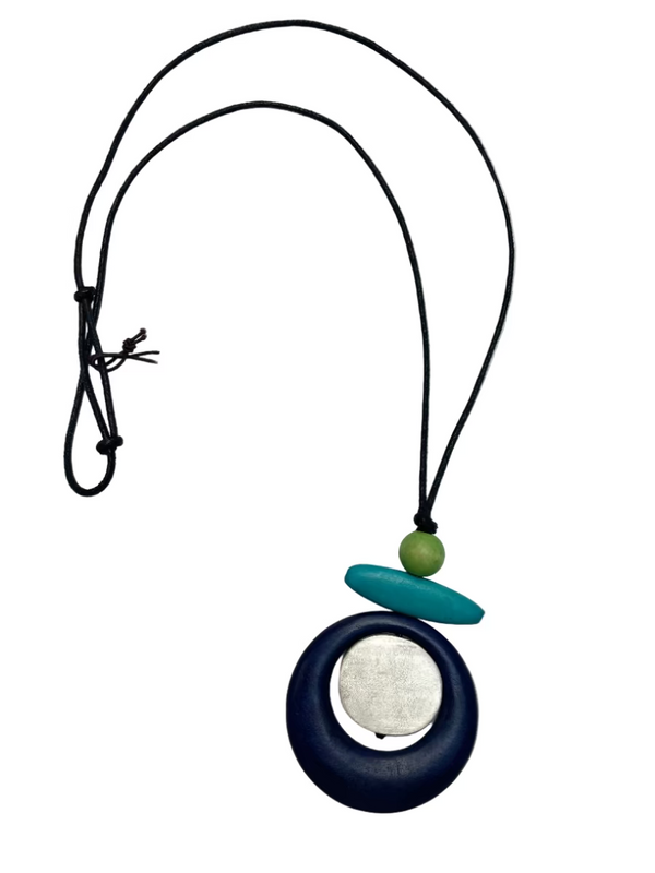 Necklace with a pendant on a white background, featuring the brand 'Cinnamon Creations'.