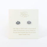 Lotus-shaped earrings on a card with a quote about kindness.