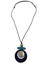 Necklace with a blue pendant and green bead on a white background