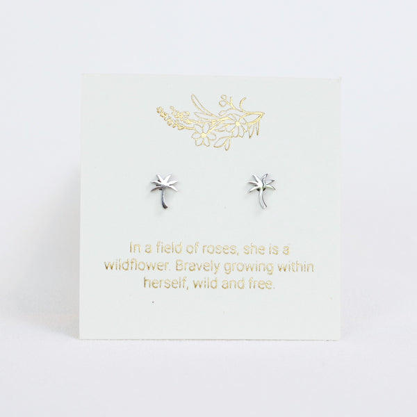 Silver earrings on a white card with gold text and design