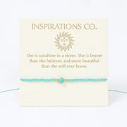 Turquoise bracelet with a quote card from Inspirations Co. on a white background