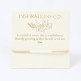 Card with gold text and branding on a white background