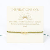 Gold bracelet on a card with inspirational message from Inspirations Co.
