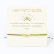 Gold bracelet on a card with inspirational message from Inspirations Co.