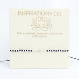 Branding card for Inspirations Co. with a woman in a meditative pose and text on a white background.