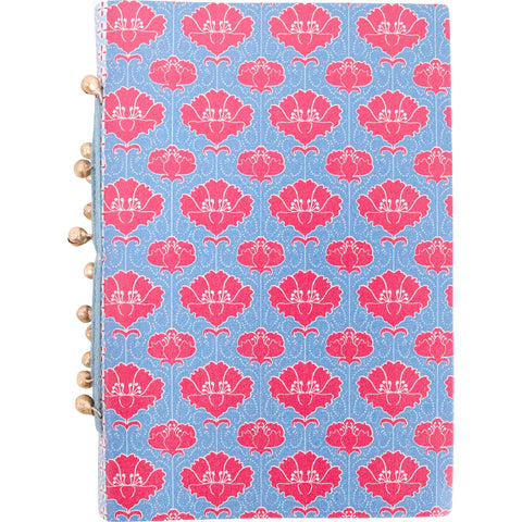Notebook with pink floral pattern on a blue background