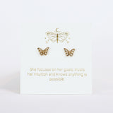 Gold butterfly earrings on a white card with motivational quote