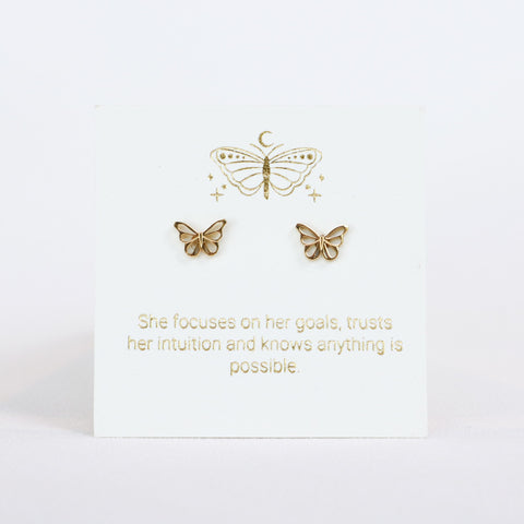 Gold butterfly earrings on a white card with motivational quote
