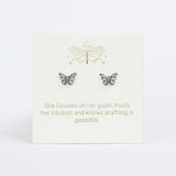 Butterfly earrings on a card with motivational quote on a white background