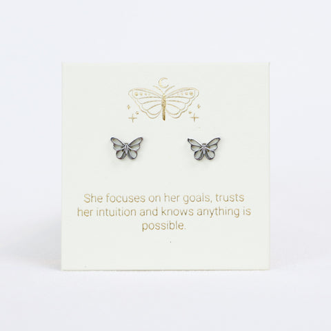 Butterfly earrings on a card with motivational quote on a white background