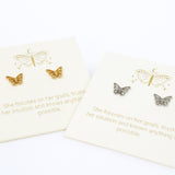 Butterfly earrings on branded cards with motivational text on a white background