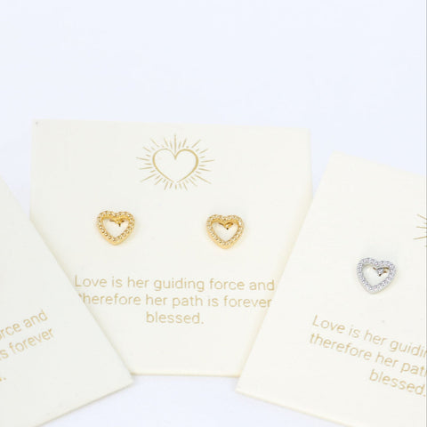 Heart-shaped earrings on cards with inspirational text on a white background