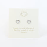 Heart-shaped earrings on a card with a motivational quote