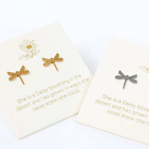 Gold and silver dragonfly earrings on white cards with text.