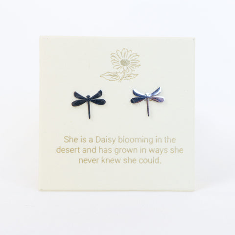 Dragonfly-shaped earrings on a card with a motivational quote