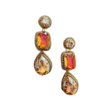 Gold earrings with colorful gemstones on a white background