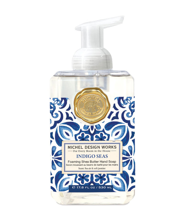 Foaming hand soap bottle with blue and white pattern and gold emblem on a white background