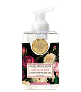 Michel Design Works foaming hand soap bottle with floral design and gold emblem on a white background
