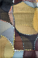 Patchwork quilt with geometric patterns in earthy tones