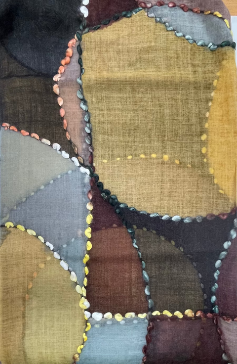 Patchwork quilt with geometric patterns in earthy tones