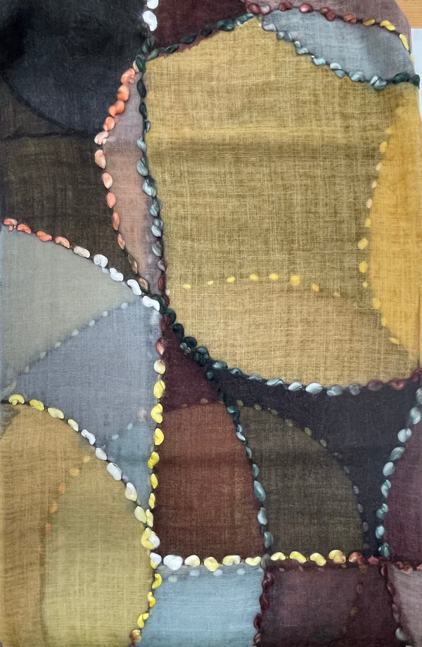 Patchwork quilt with geometric patterns in earthy tones