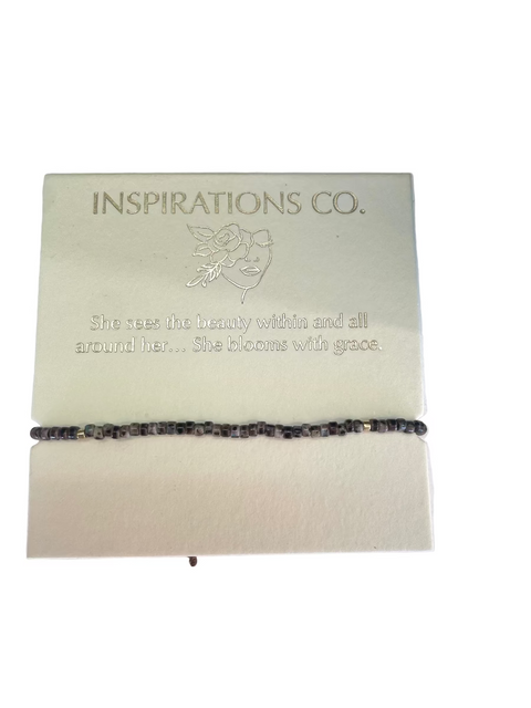 Bracelet on a card with 'Inspirations Co.' branding and text.