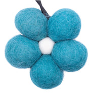 Teal felt flower toy on a white background