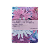 Floral notebook with a quote on a white background
