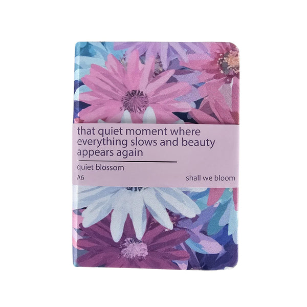Floral notebook with a quote on a white background