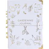 Gardening journal with gold illustrations on a white background