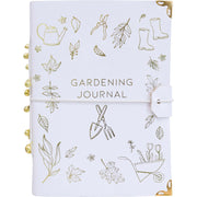 Gardening journal with gold illustrations on a white background