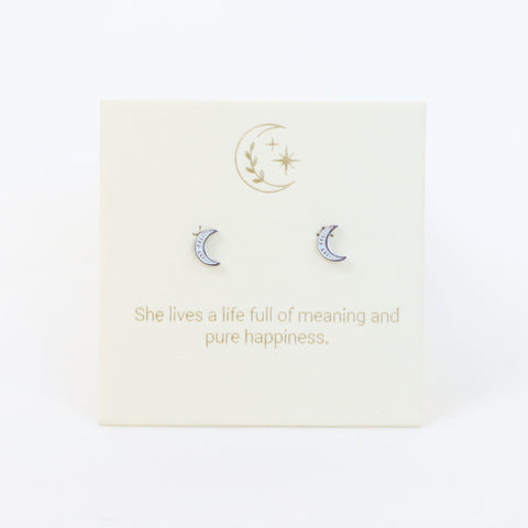 Moon-shaped earrings on a card with a motivational quote