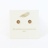 Decorative card with gold designs and text on a white background