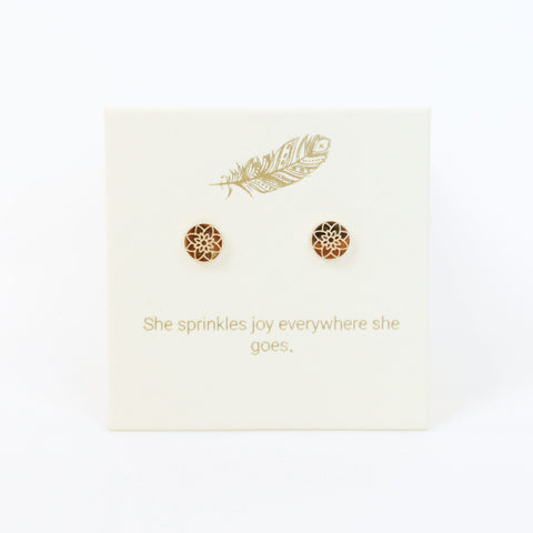 Decorative card with gold designs and text on a white background