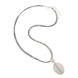Silver necklace with a textured pendant on a white background