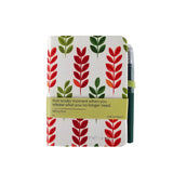 Notebook with red and green leaf pattern on a white background