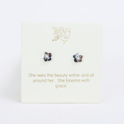 Pair of earrings on a card with motivational quote