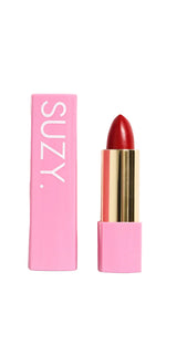 Red lipstick with pink packaging and 'SUZY' branding on a white background