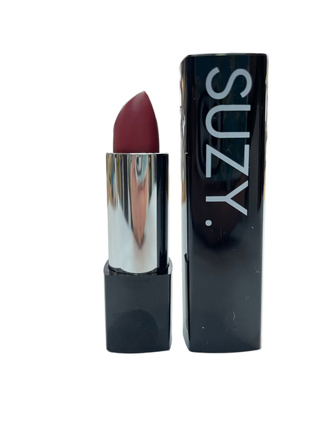 Lipstick with packaging labeled 'SUZY' on a white surface.