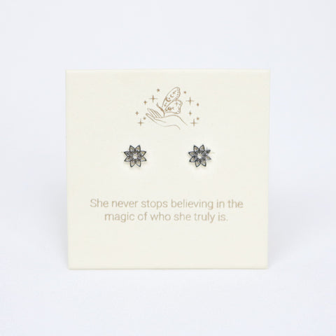 Earring set with floral designs on a card with motivational quote