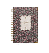 Floral patterned planner with 'Agenda' label on a gray background