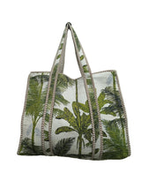 Tote bag with palm tree design on a plain background