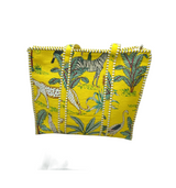 Yellow bag with animal print on a white surface